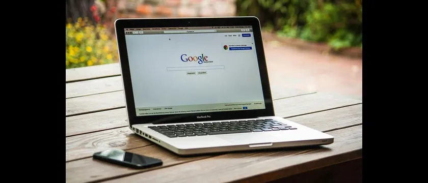 Student using an ultra-portable laptop for coding, note-taking, and online classes while traveling or working in a café.